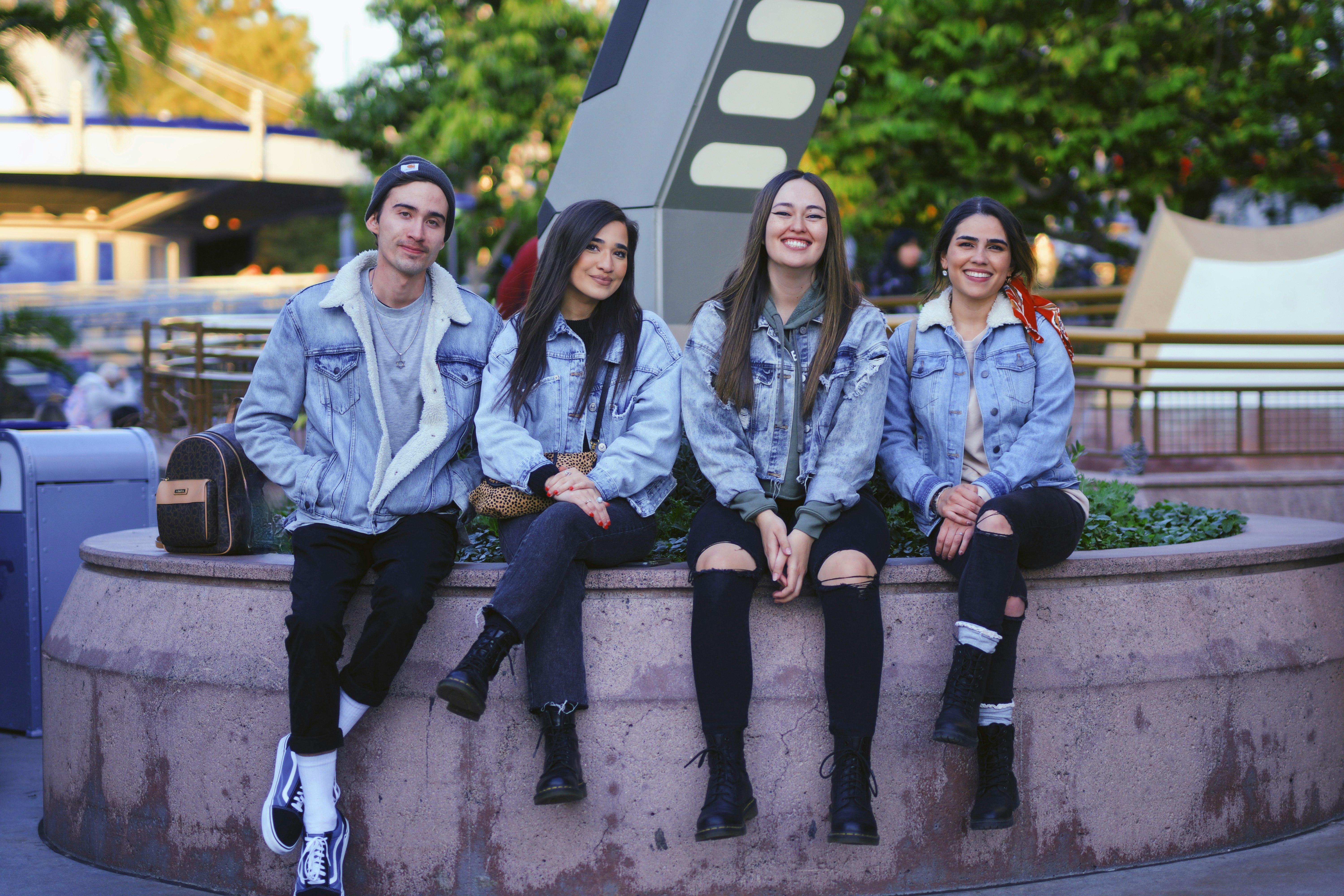 3 women sitting on concrete bench